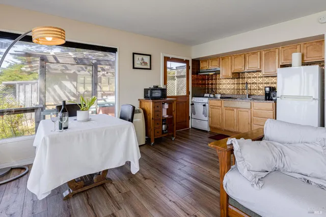 a bathroom with a sink a mirror and a shower