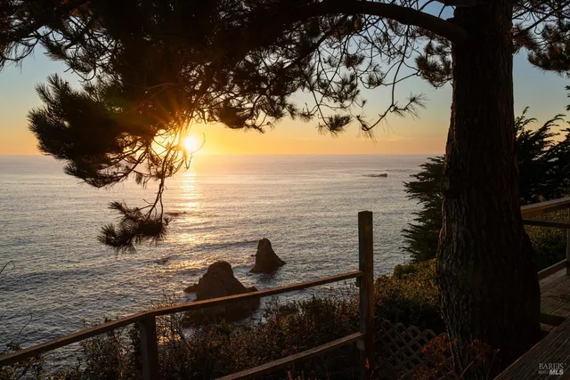 a bedroom with a bed a mirror and desk