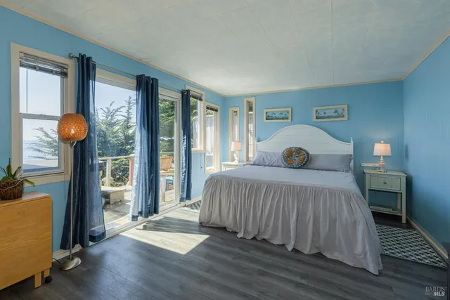 a kitchen with stove cabinets and wooden floor