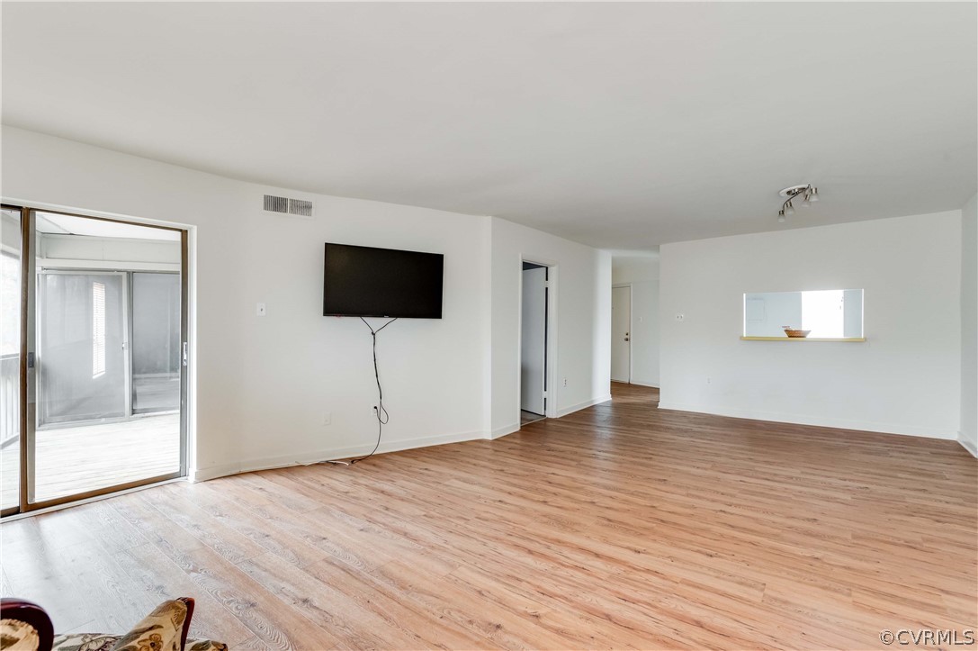 10292 Iron Mill Road North Chesterfield, VA 23235 - Photo 12 of 24 a view of an empty room with wooden floor and a window