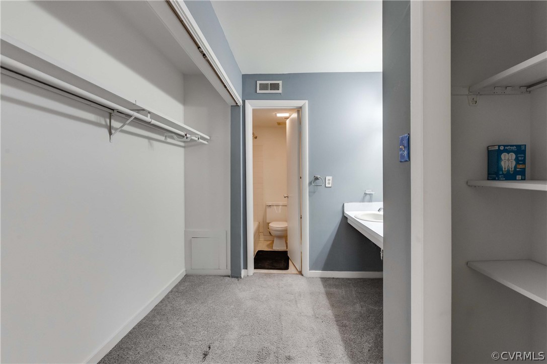 10292 Iron Mill Road North Chesterfield, VA 23235 - Photo 17 of 24 a view of an empty room with cabinet and wooden floor