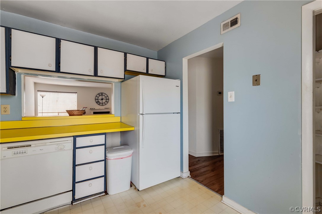 10292 Iron Mill Road North Chesterfield, VA 23235 - Photo 9 of 24 a view of a kitchen with a sink and a refrigerator