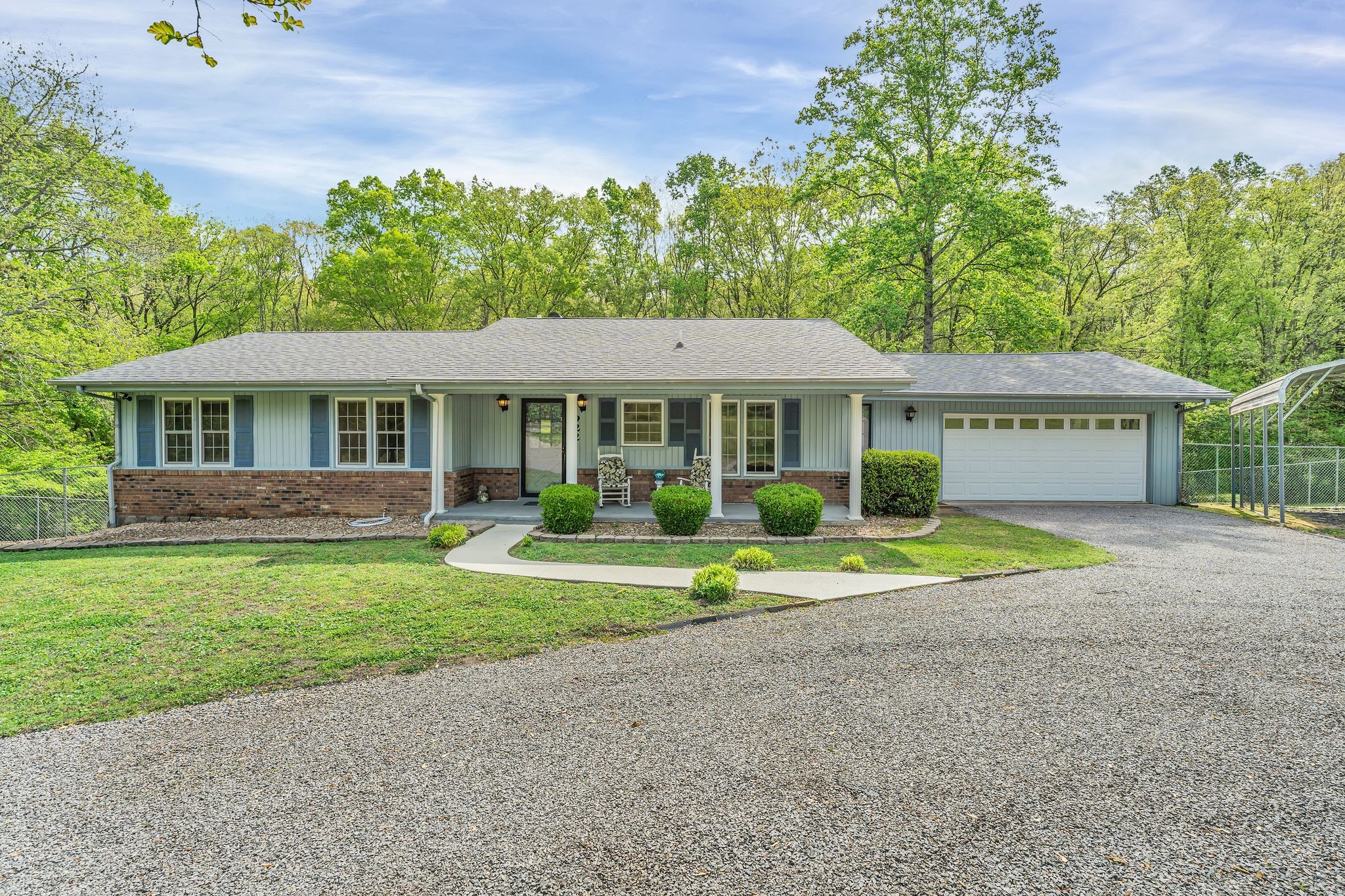 922 Hayes Road Lawrenceburg, TN 38464 - Photo 1 of 36 a front view of a house with a yard