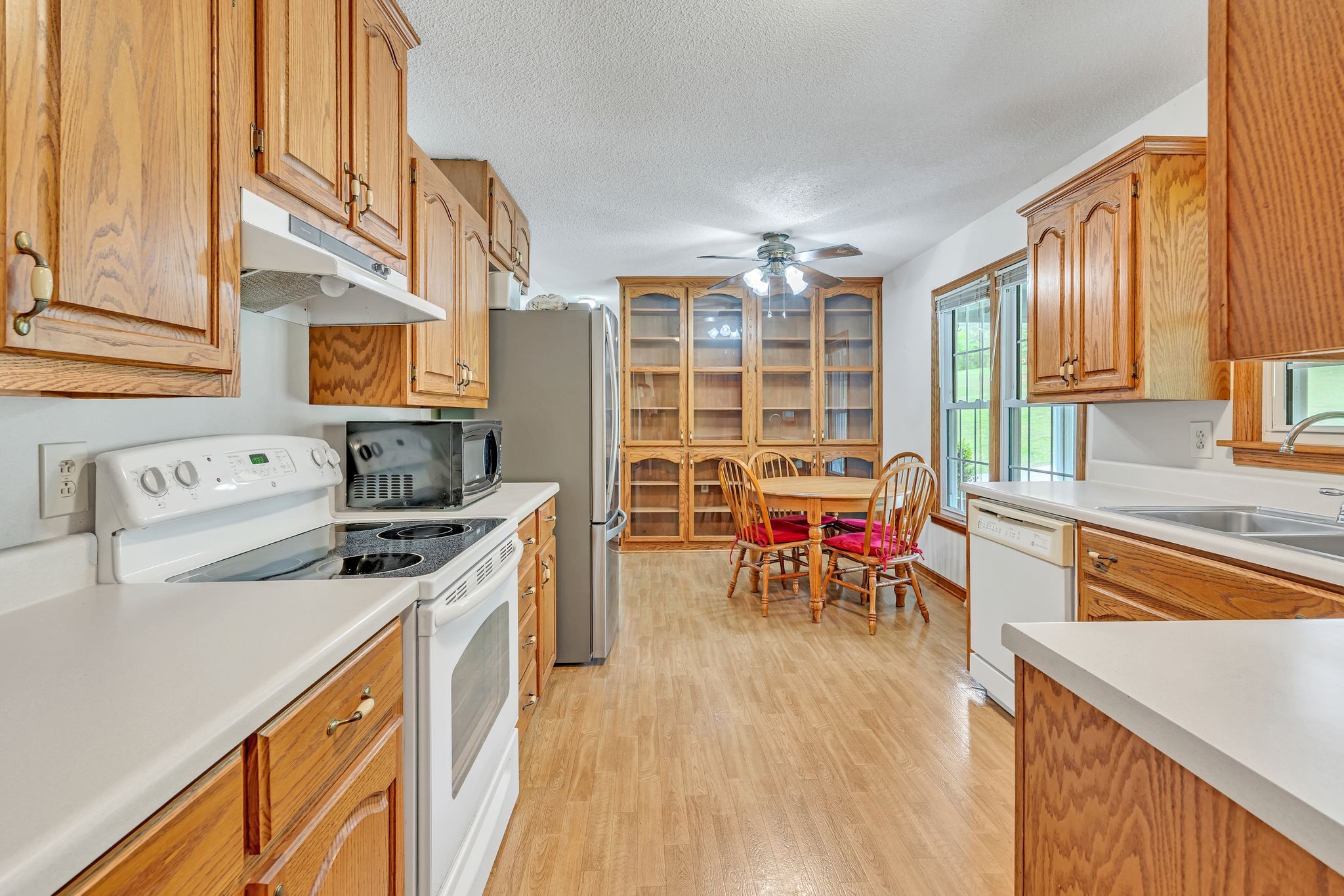 922 Hayes Road Lawrenceburg, TN 38464 - Photo 11 of 36 a kitchen with stainless steel appliances granite countertop a stove and a refrigerator