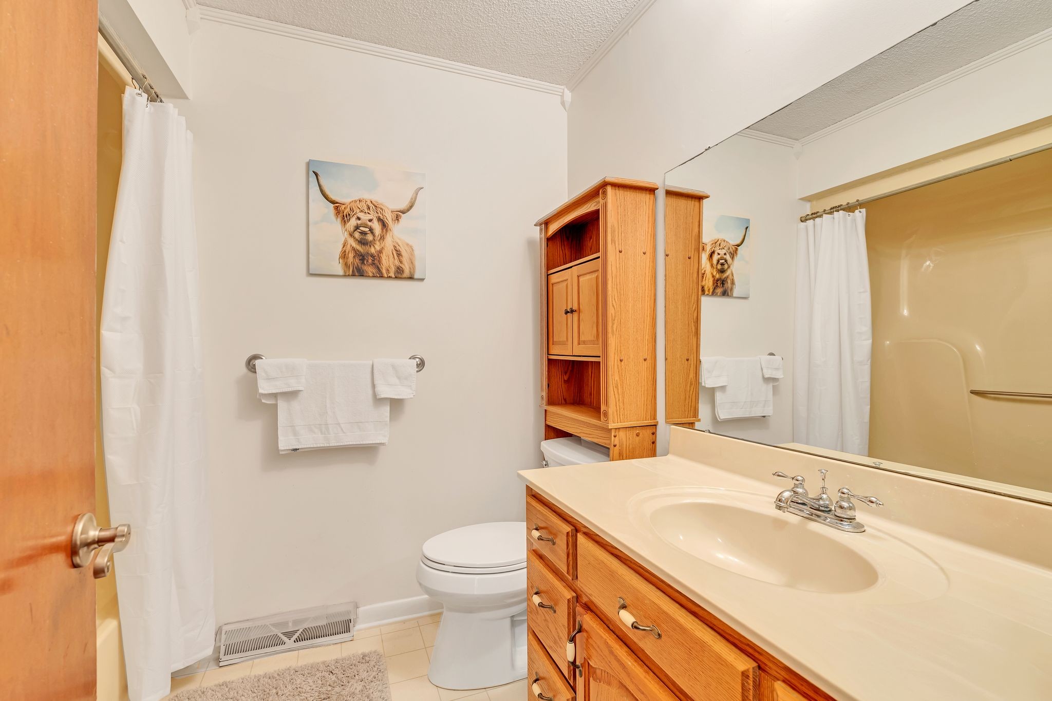 922 Hayes Road Lawrenceburg, TN 38464 - Photo 16 of 36 a bathroom with a granite countertop sink toilet and shower
