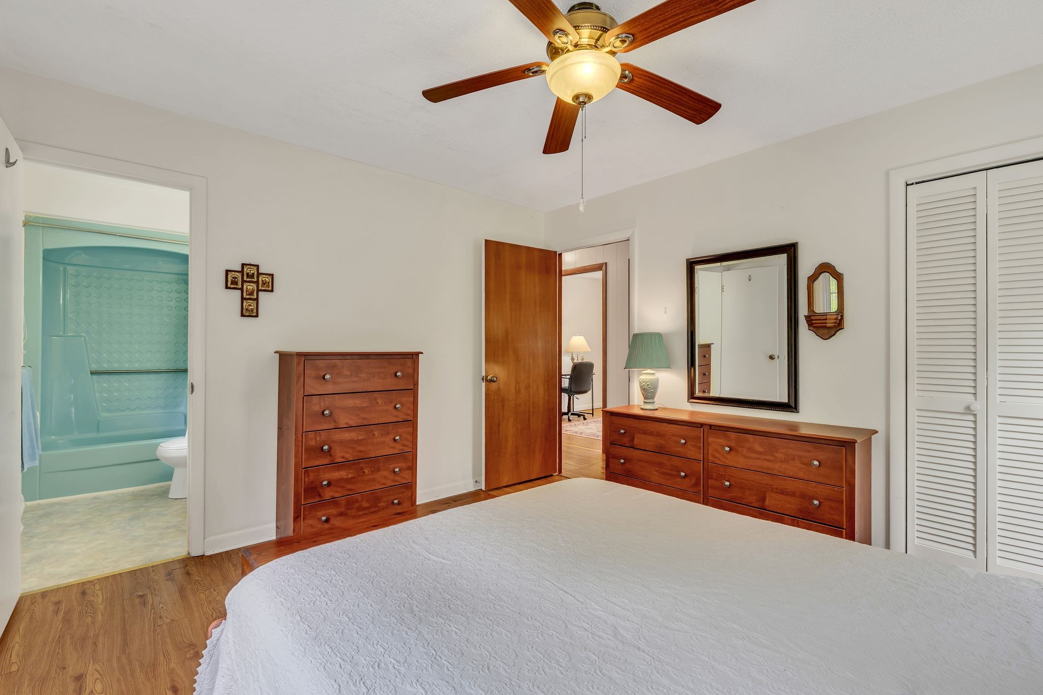 922 Hayes Road Lawrenceburg, TN 38464 - Photo 19 of 36 a bedroom with a bed and a dresser