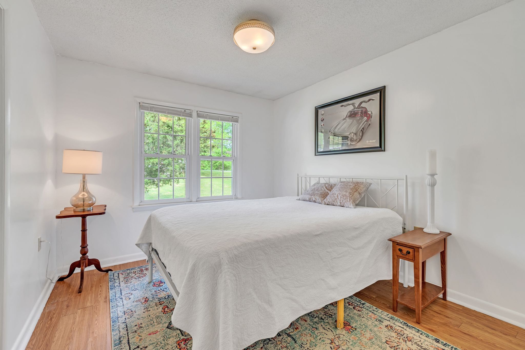 922 Hayes Road Lawrenceburg, TN 38464 - Photo 21 of 36 a bed room with a bed and a lamp