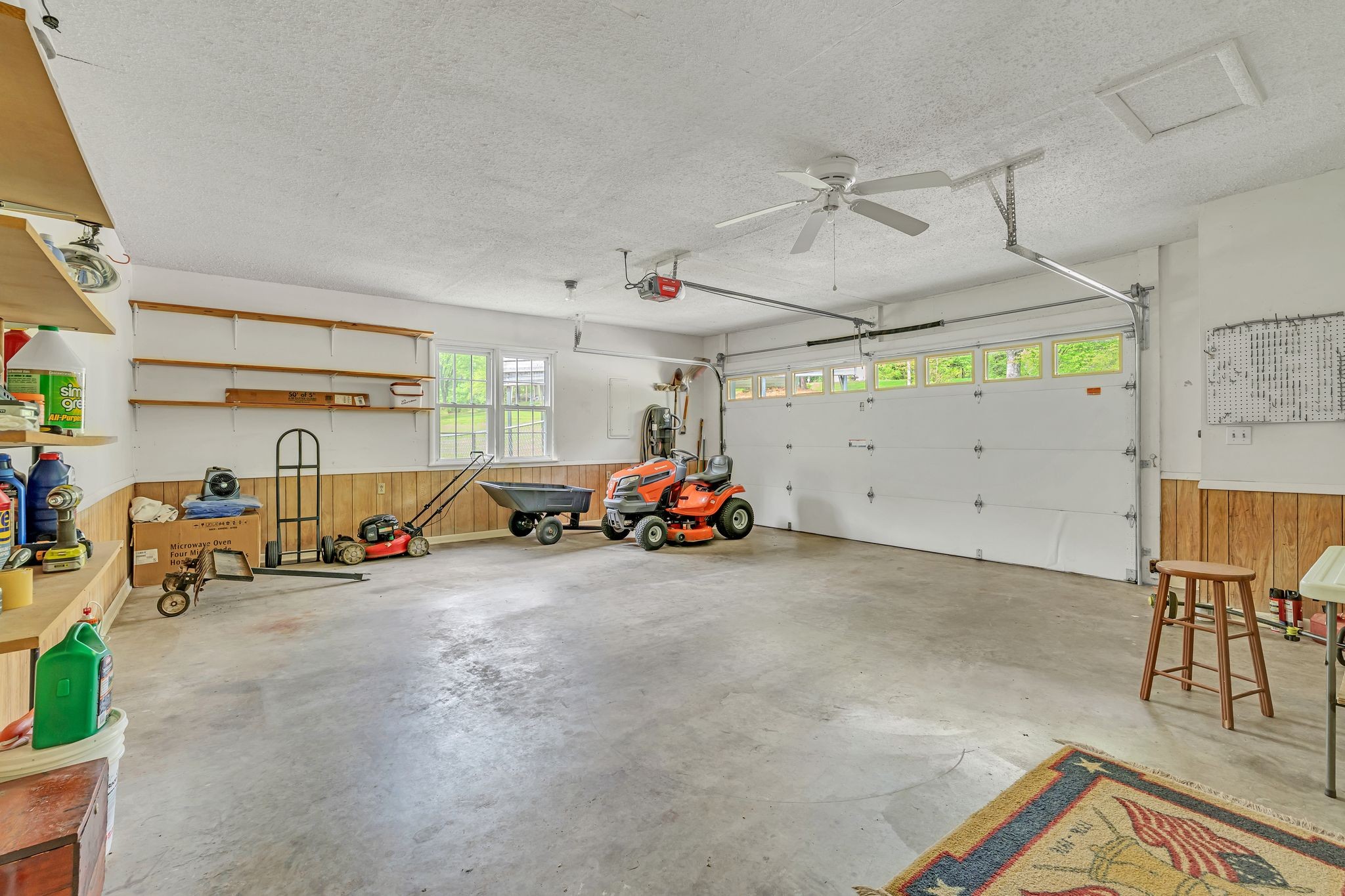922 Hayes Road Lawrenceburg, TN 38464 - Photo 23 of 36 a view of a garage with a bike and car