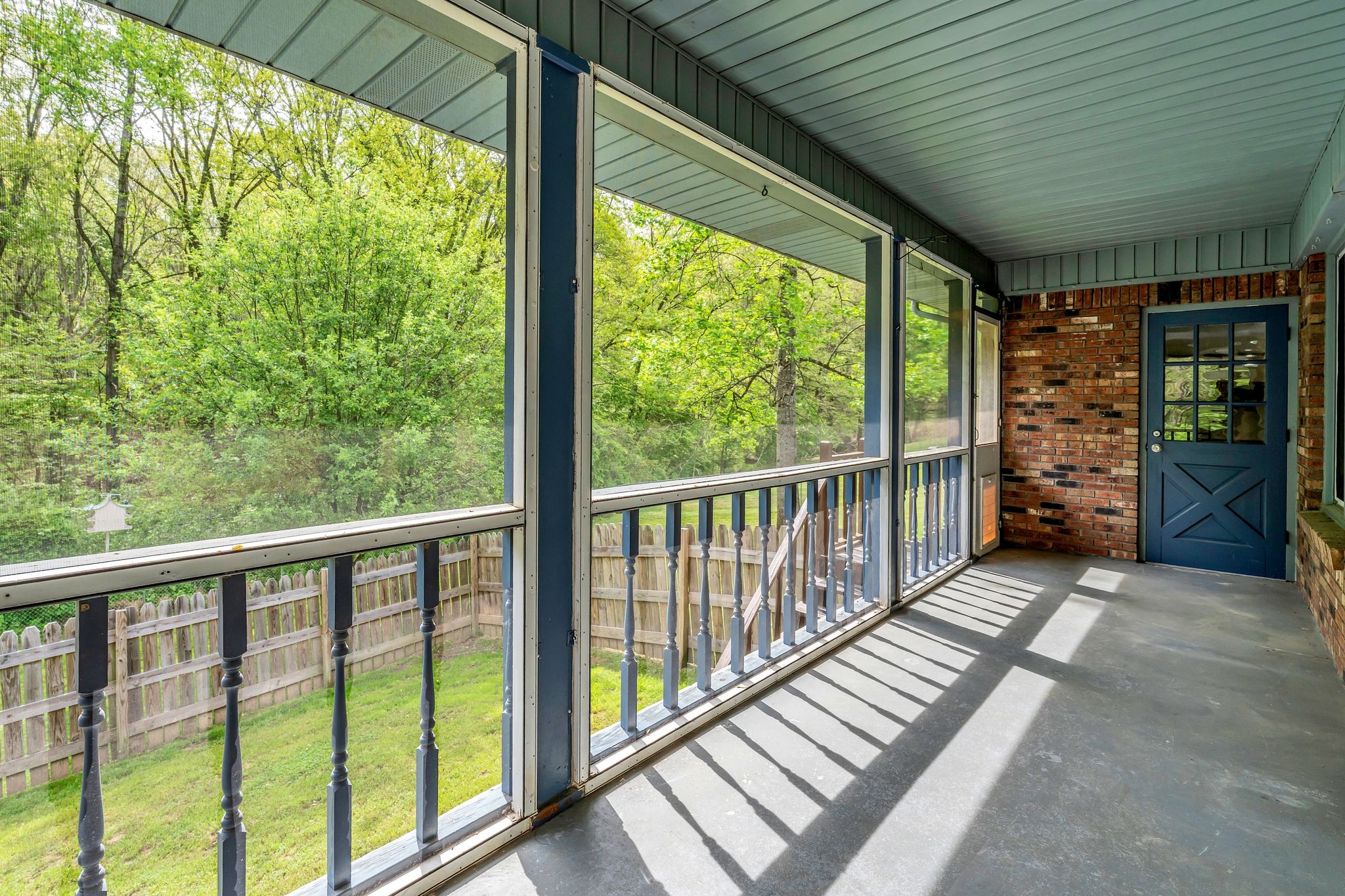 922 Hayes Road Lawrenceburg, TN 38464 - Photo 29 of 36 a view of a porch with wooden floor in front of red door