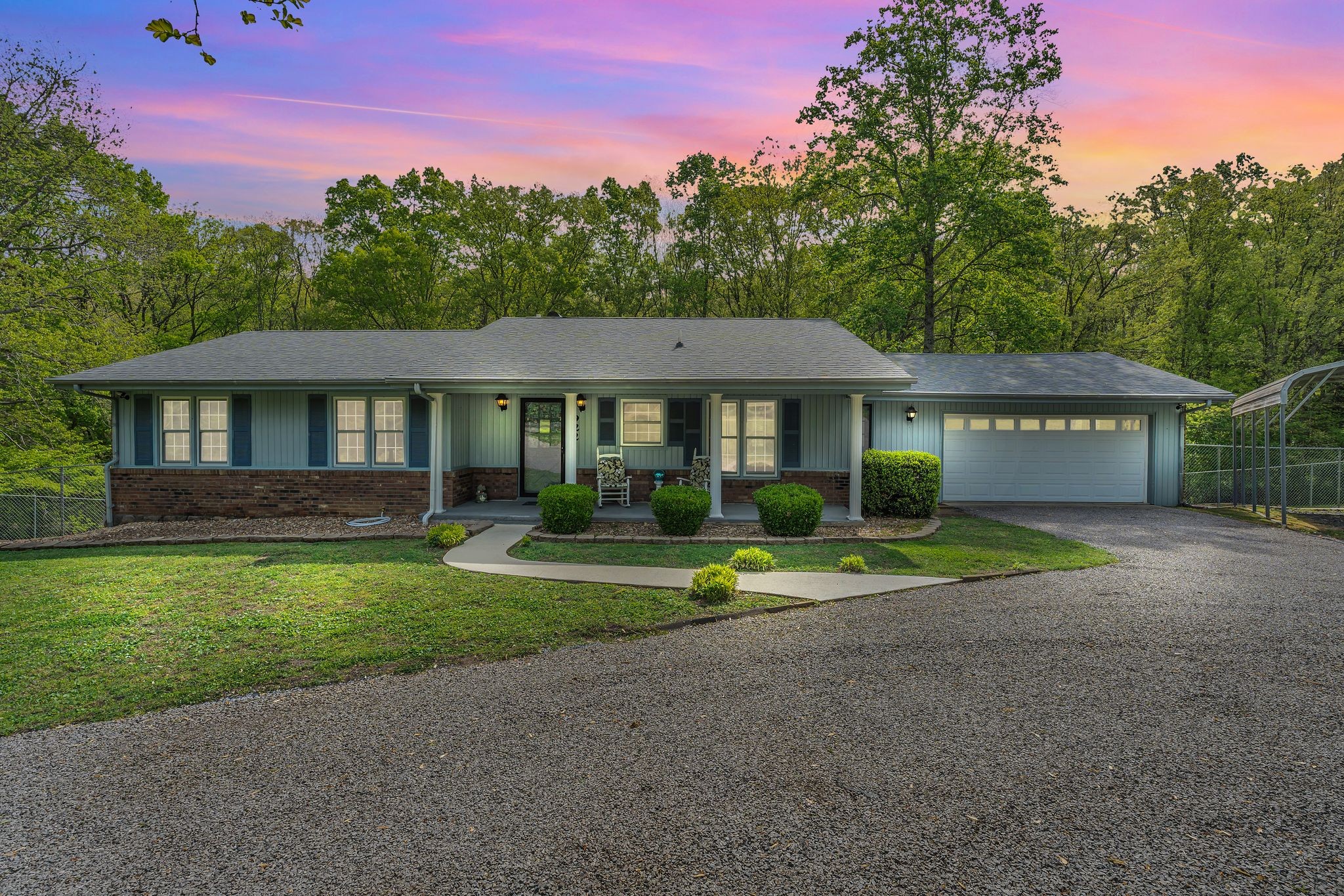 922 Hayes Road Lawrenceburg, TN 38464 - Photo 34 of 36 a front view of a house with a yard and trees