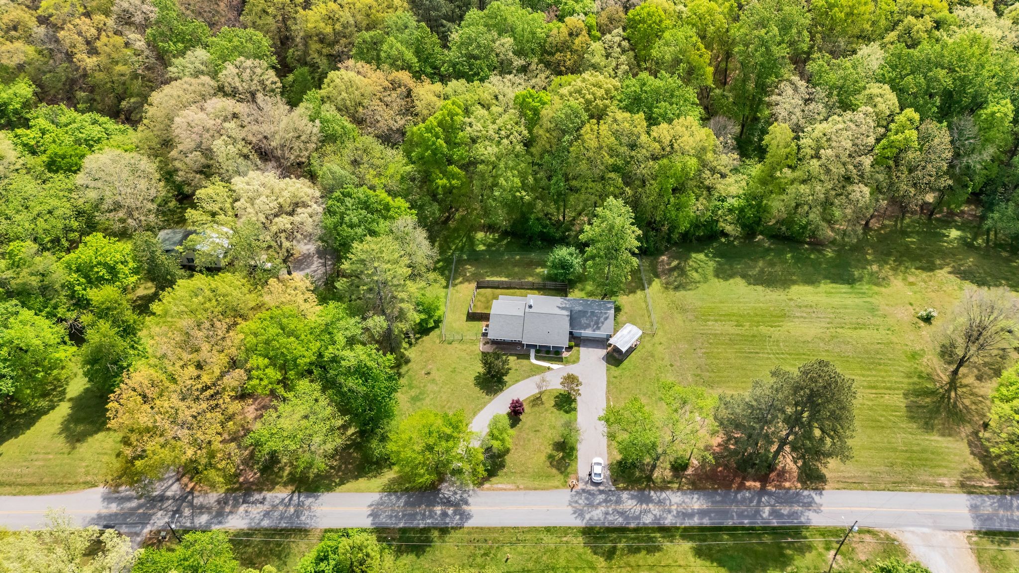 922 Hayes Road Lawrenceburg, TN 38464 - Photo 5 of 36 an aerial view of residential house with outdoor space and trees all around