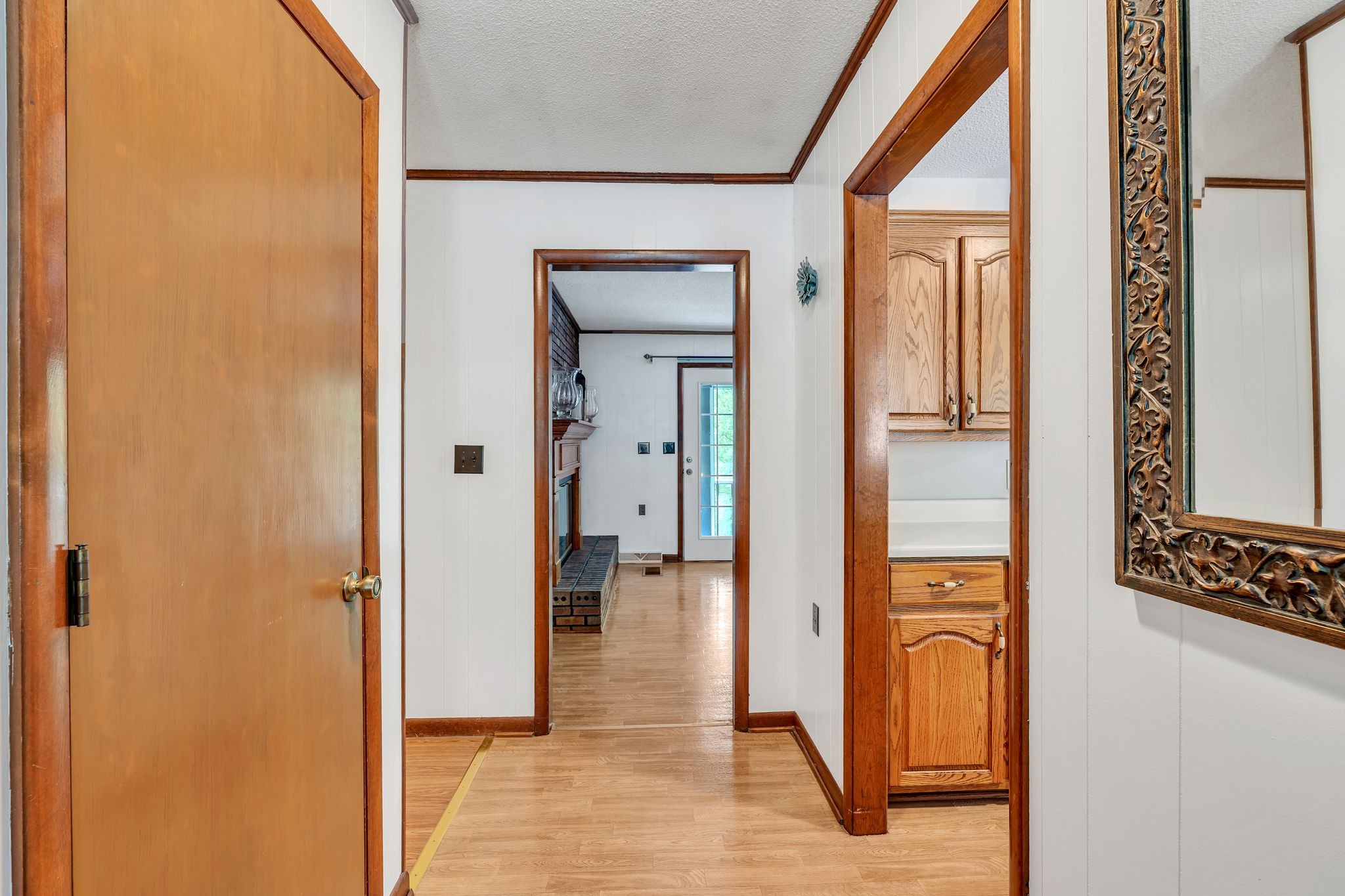 922 Hayes Road Lawrenceburg, TN 38464 - Photo 6 of 36 a view of a hallway with wooden floor and living room