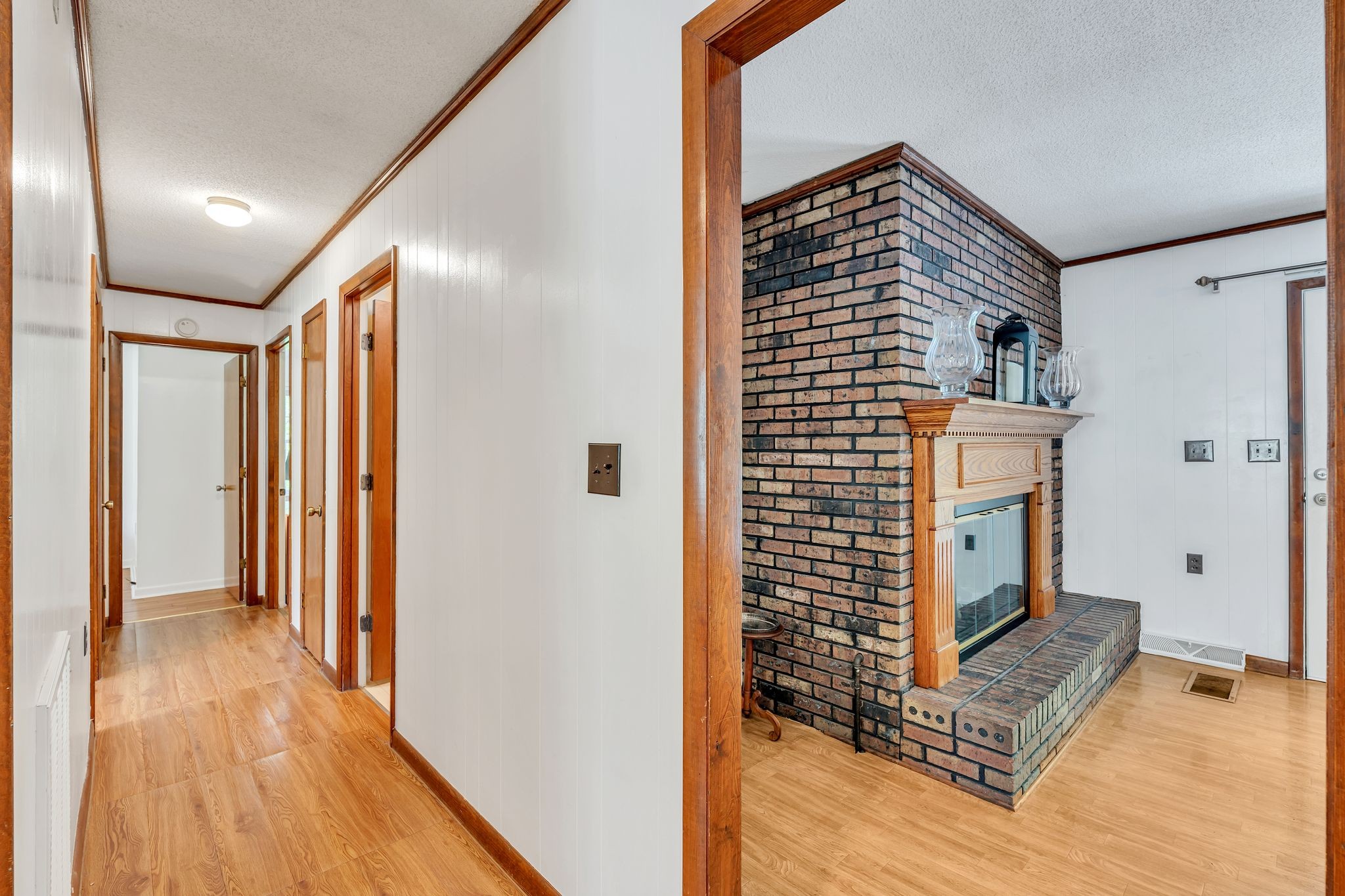 922 Hayes Road Lawrenceburg, TN 38464 - Photo 7 of 36 a view of a hallway with wooden floor and staircase