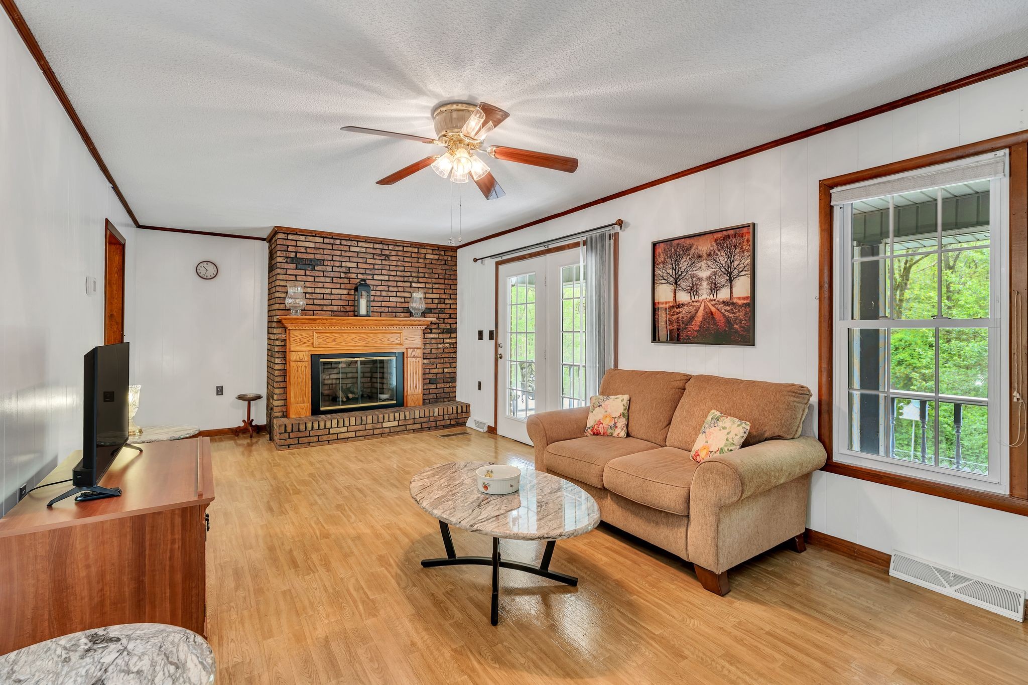 922 Hayes Road Lawrenceburg, TN 38464 - Photo 10 of 36 a living room with furniture and a fireplace