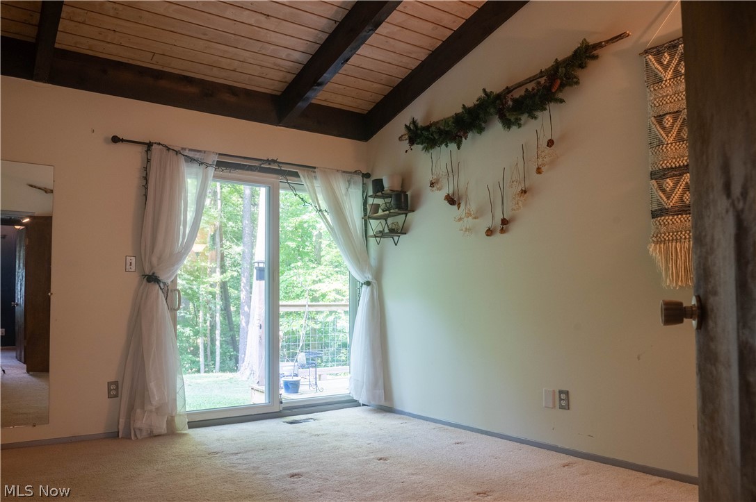 11629 Edgewood Road Chardon, OH 44024 - Photo 26 of 48 Bedroom two has sliding door to the side yard and vaulted ceilings