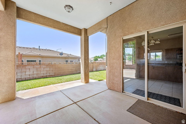 2226 East 140 South St. George, UT 84790 - Photo 18 of 20 Covered concrete patio with stucco columns and exterior wall