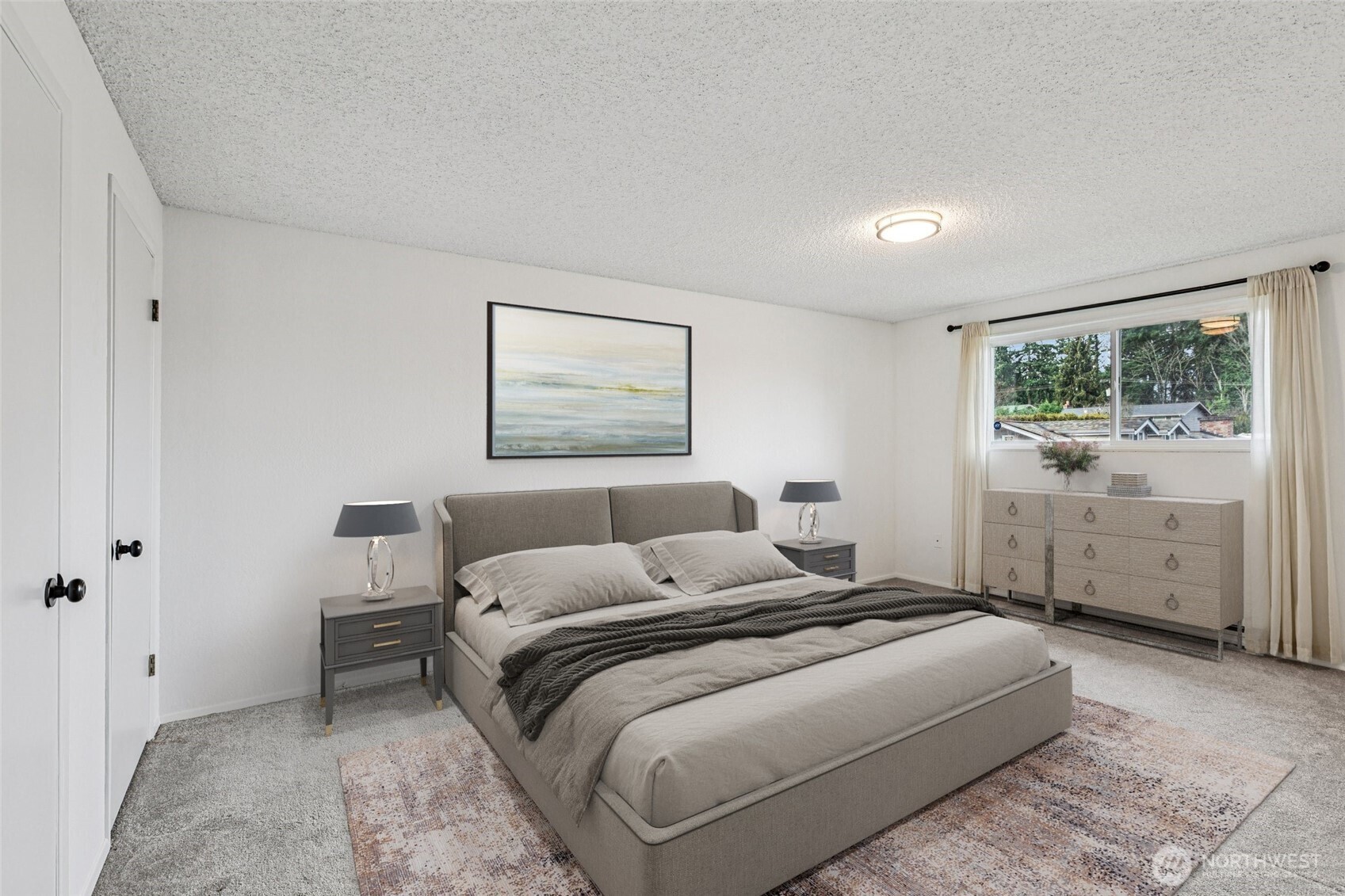 7909 218th Street Southwest, Unit 4 Edmonds, WA 98026 - Photo 15 of 29 a bedroom with a bed and a painting on the wall