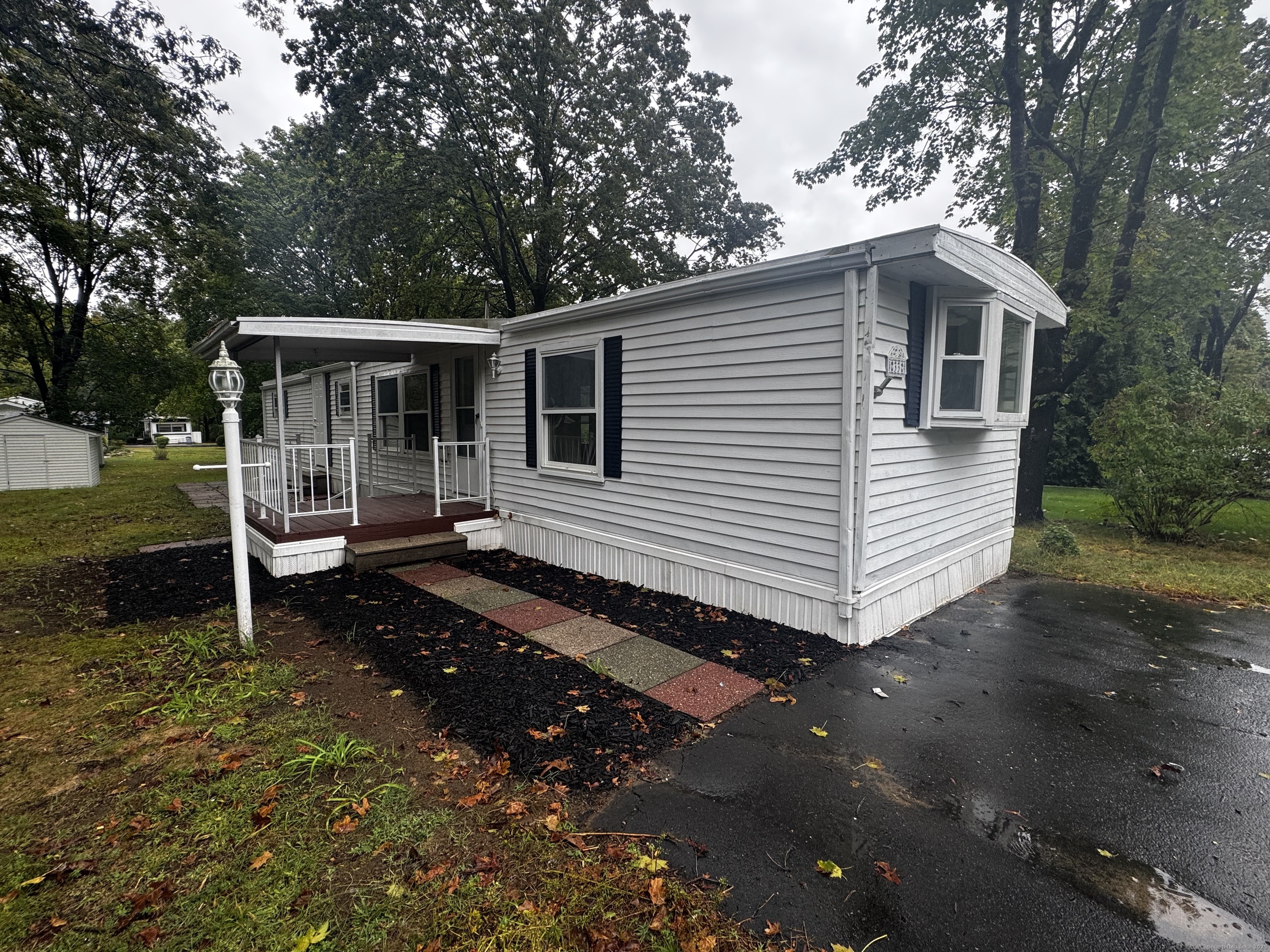 33 Whitewood Road Killingworth, CT 06419 - Photo 2 of 8 a front view of a house with garden