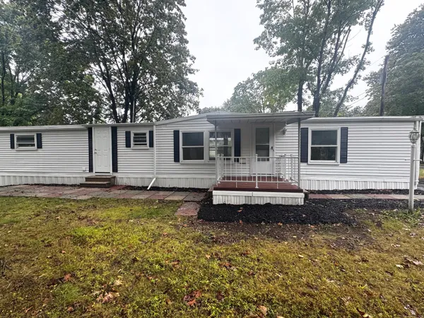 a front view of a house with swimming pool