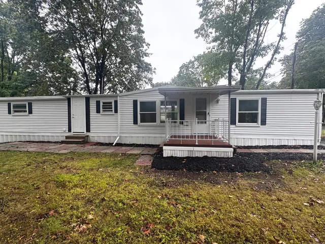 a front view of a house with swimming pool