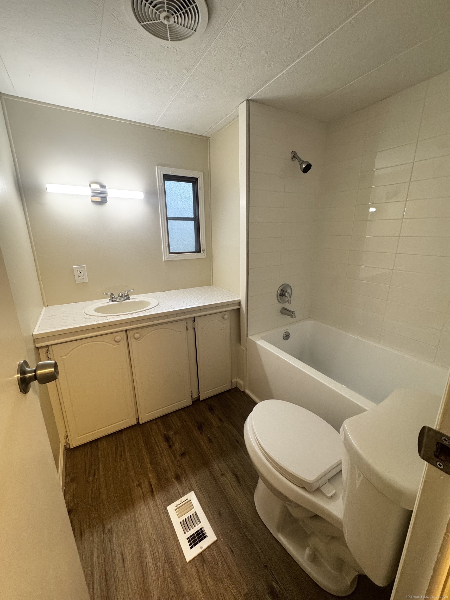 33 Whitewood Road Killingworth, CT 06419 - Photo 8 of 8 a bathroom with a toilet a sink and bathtub