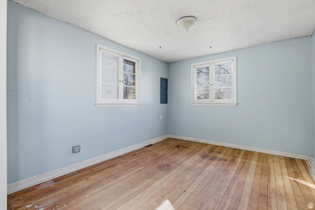 869 West Center Street Provo, UT 84601 - Photo 22 of 32 Empty room featuring light wood-style floors and electric panel