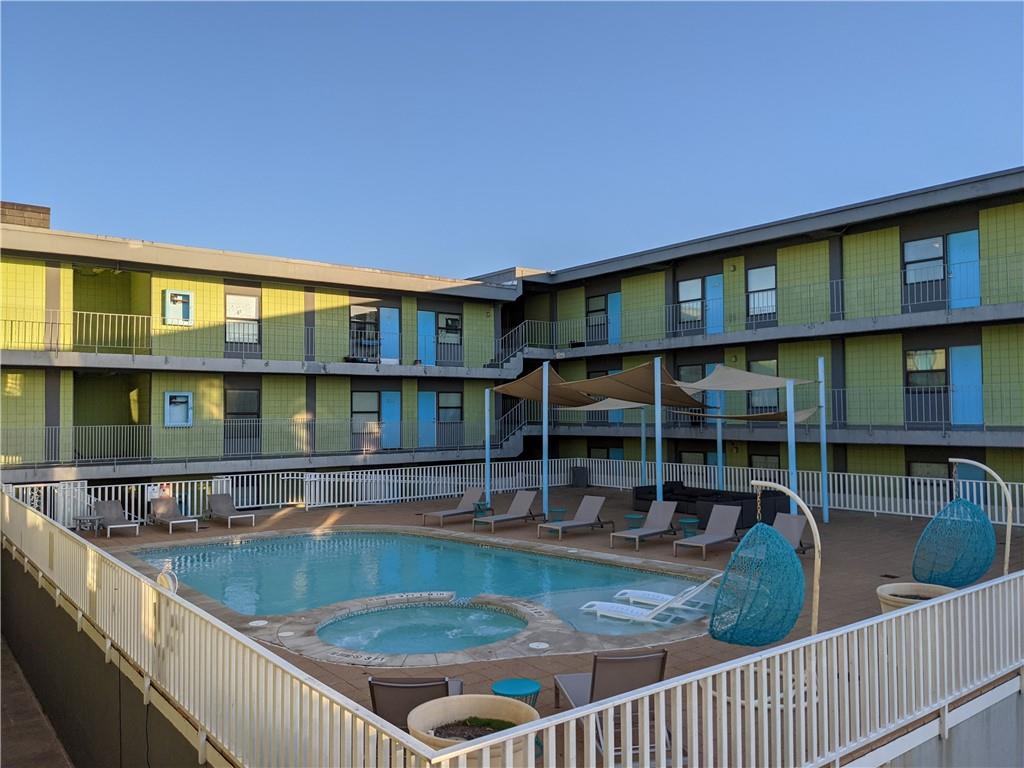 2408 Leon Street, Unit 202 Austin, TX 78705 - Photo 6 of 7 a view of a house with pool from a balcony