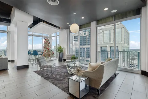 a view of a city from a dining room with a large window