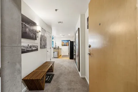 a room with furniture and a view of bathroom