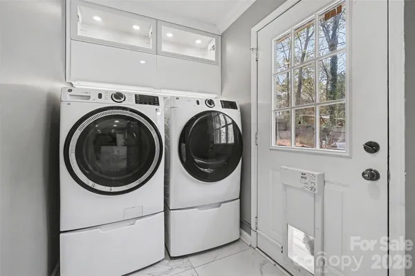 a utility room with dryer and washer