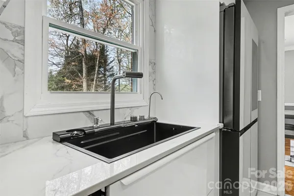 a close view of sink and microwave