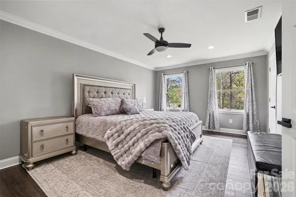 a bedroom with a large bed and a window
