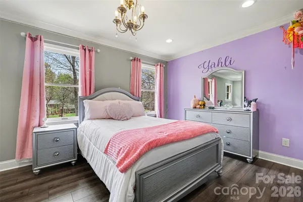 a bedroom with a bed and a large dresser