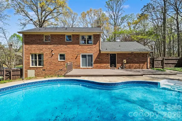 a front view of a house with swimming pool