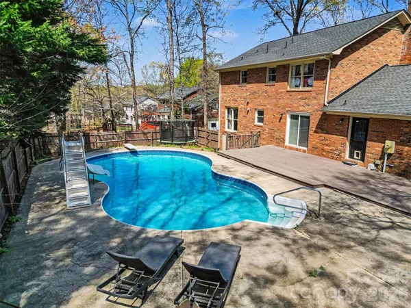 a view of a house with swimming pool