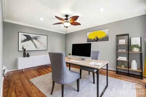 a view of a workspace with furniture