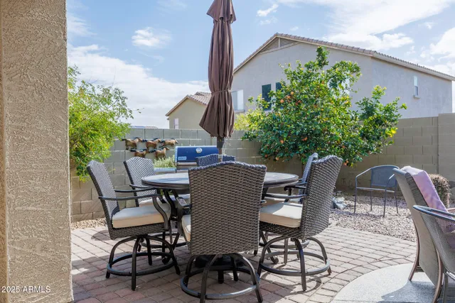 a view of a chairs and table in patio