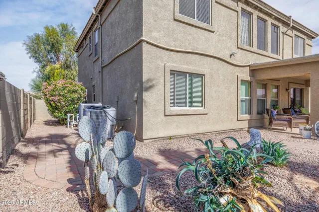 a front view of a house with outdoor seating