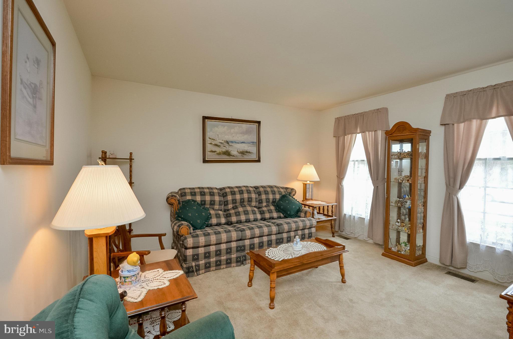 575 Pasture Brook Road Severn, MD 21144 - Photo 3 of 29 a living room with furniture a lamp and a window