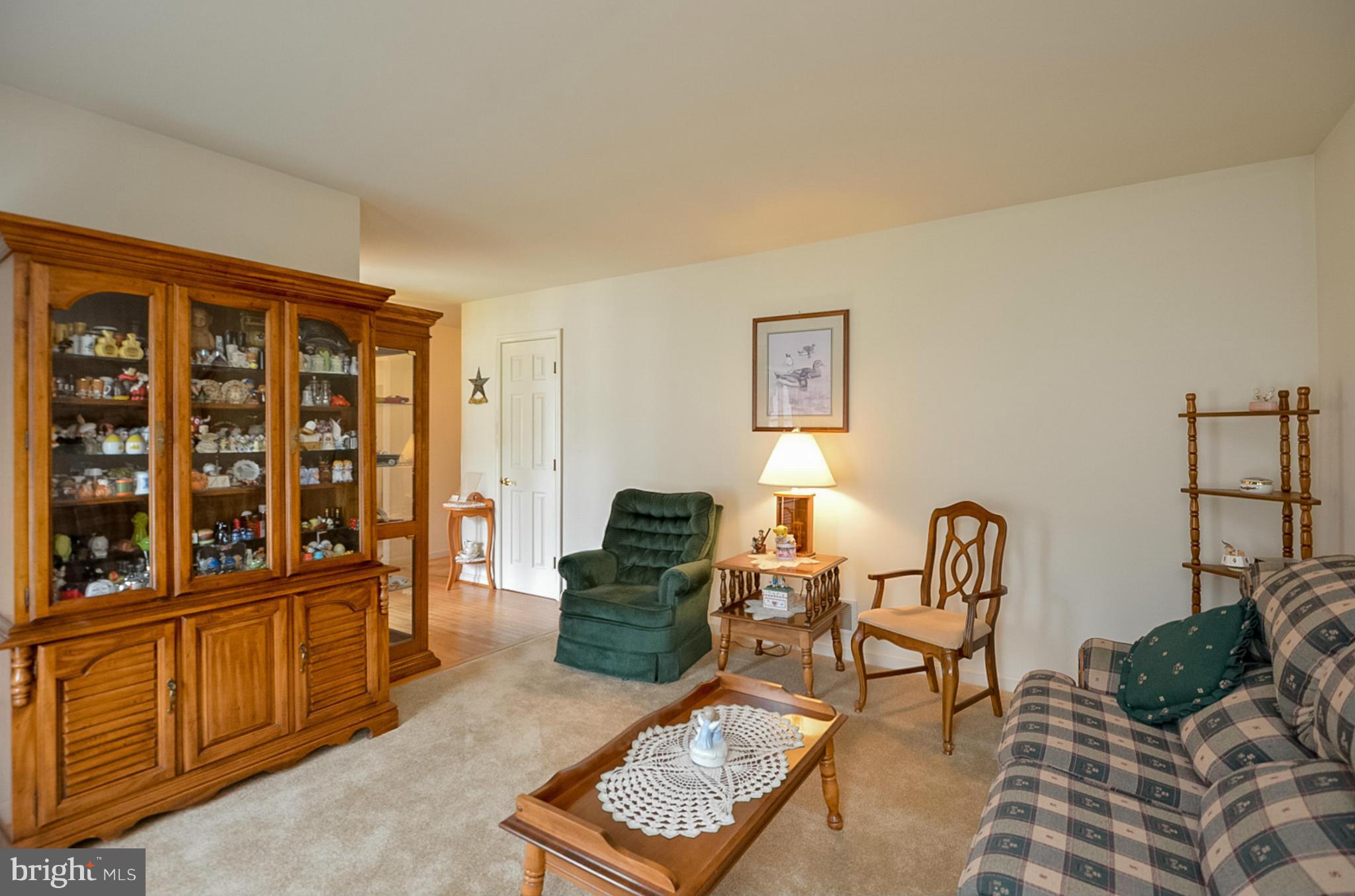 575 Pasture Brook Road Severn, MD 21144 - Photo 4 of 29 a living room with furniture and two windows