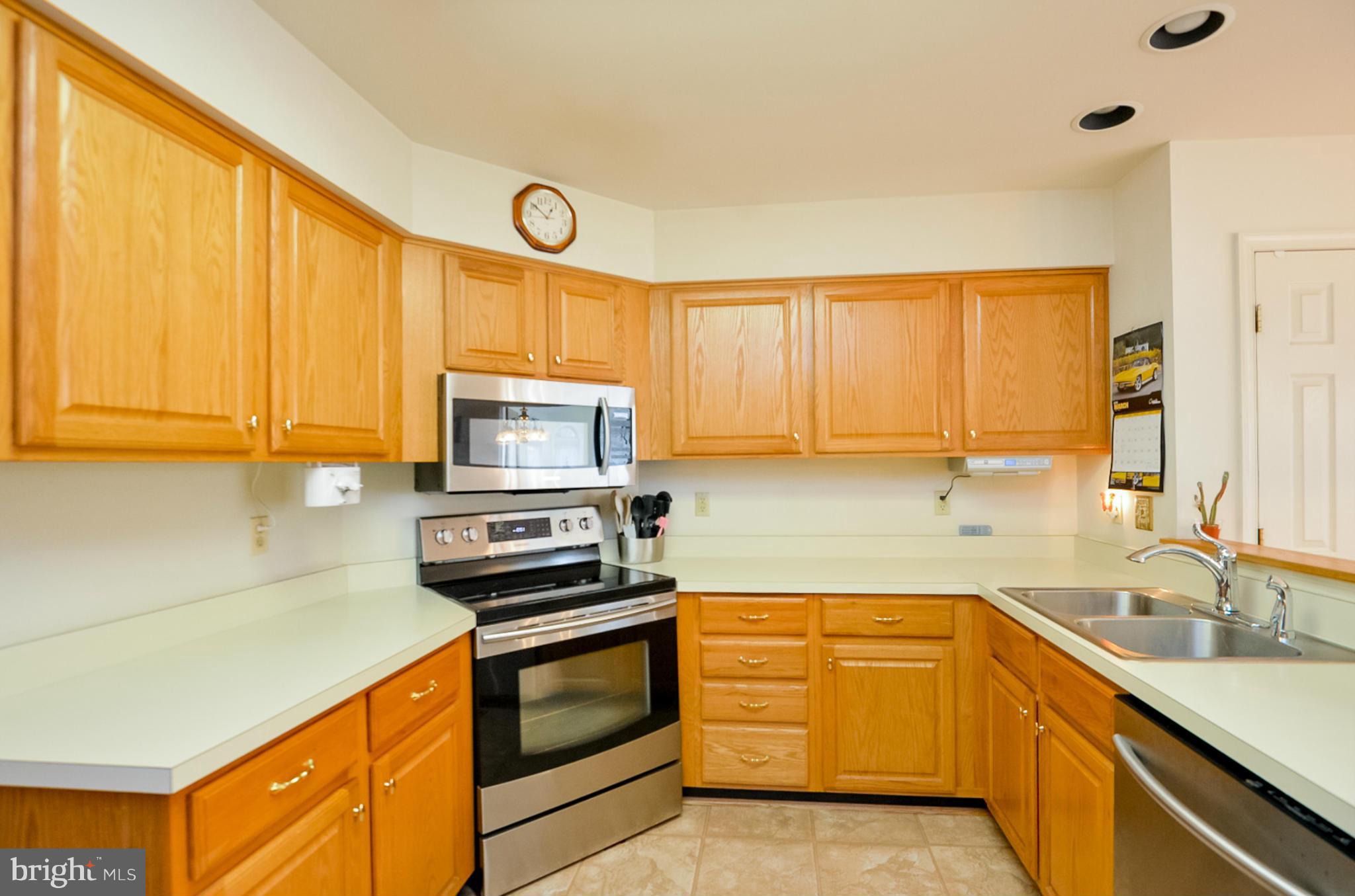 575 Pasture Brook Road Severn, MD 21144 - Photo 7 of 29 a kitchen with a sink stove and microwave