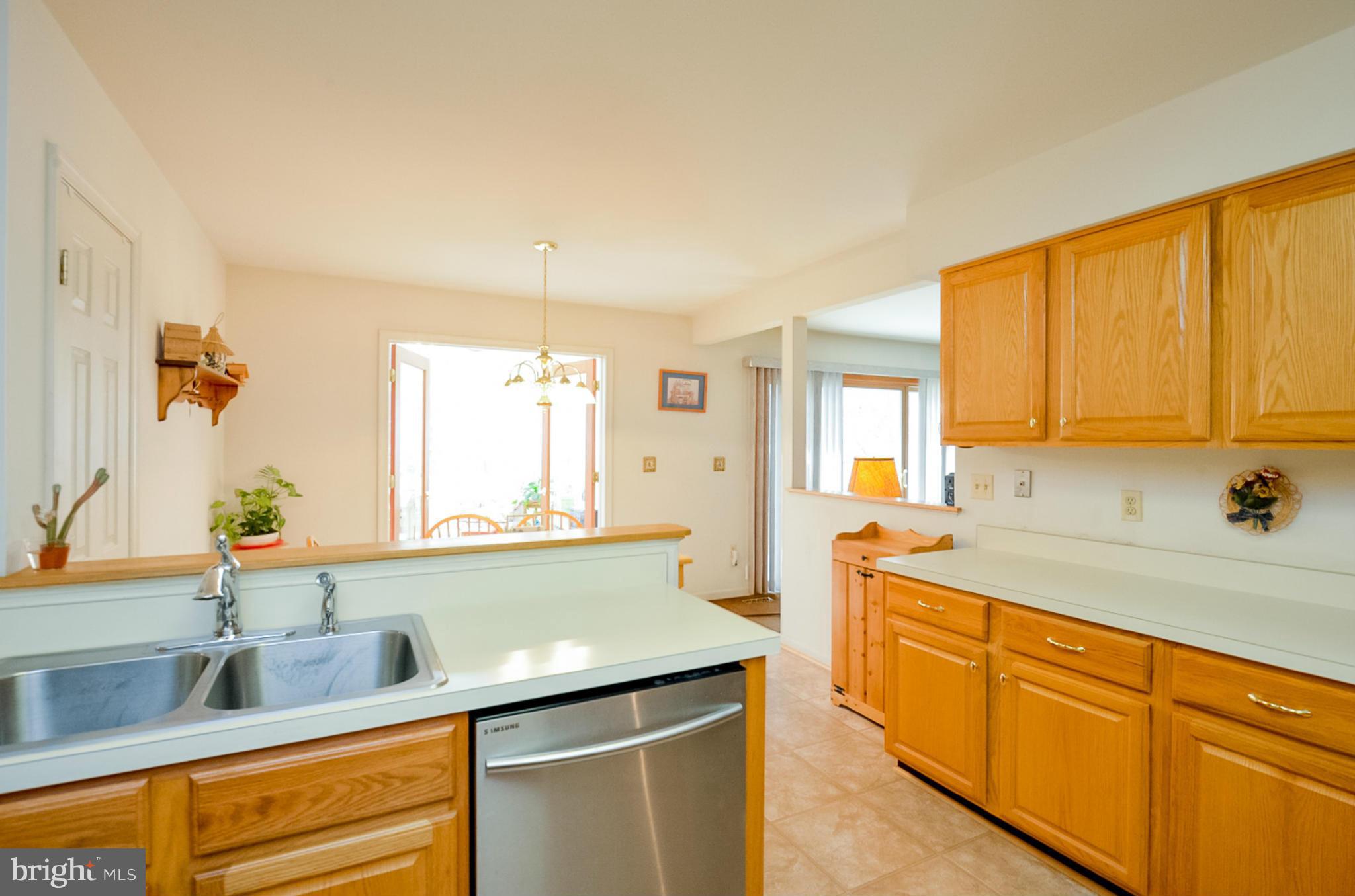 575 Pasture Brook Road Severn, MD 21144 - Photo 8 of 29 a kitchen with stainless steel appliances granite countertop a sink and cabinets