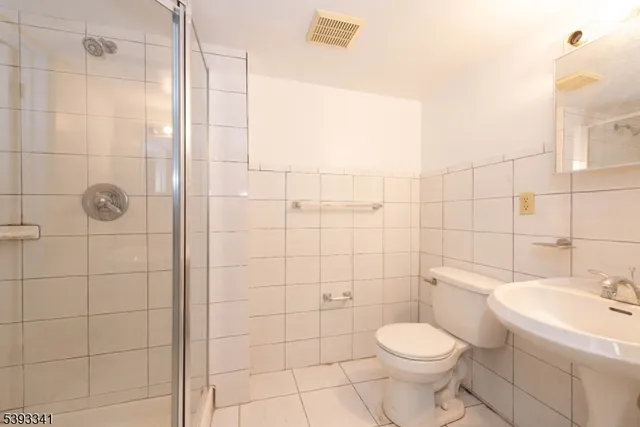 a utility room with sink dryer and washer