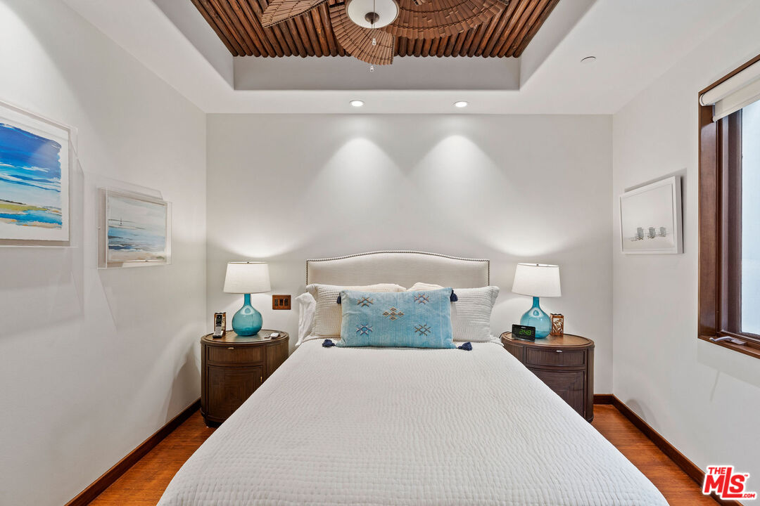 31554 Victoria Point Road Malibu, CA 90265 - Photo 25 of 45 a bedroom with bed and window