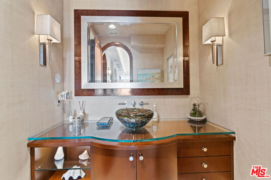 31554 Victoria Point Road Malibu, CA 90265 - Photo 26 of 45 a bathroom with a sink and a mirror