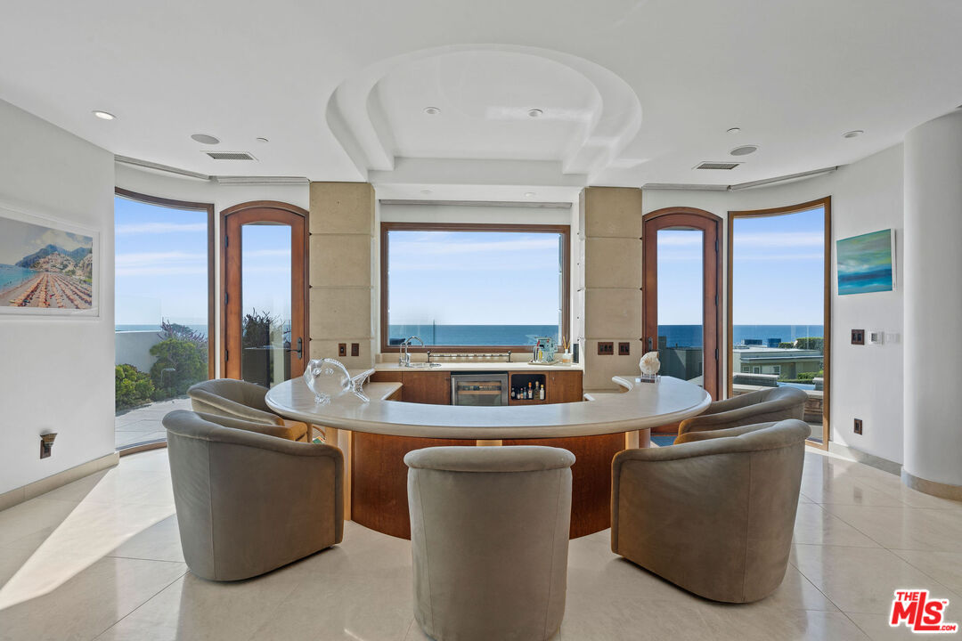 31554 Victoria Point Road Malibu, CA 90265 - Photo 10 of 45 a room with furniture and a large window