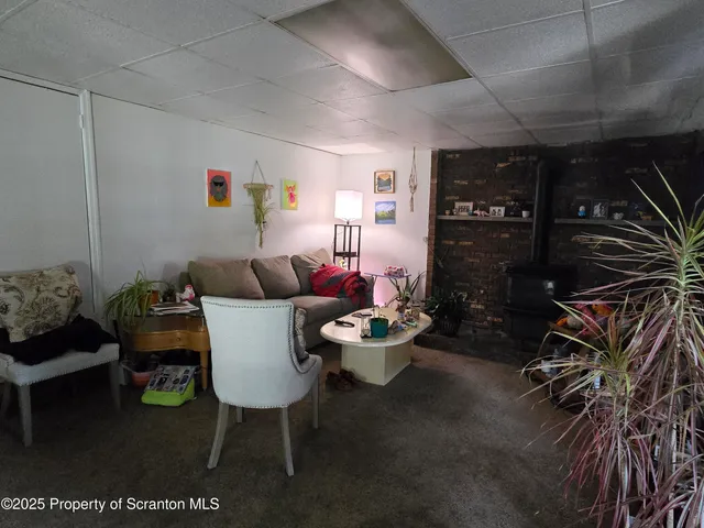 a living room with furniture and a rug
