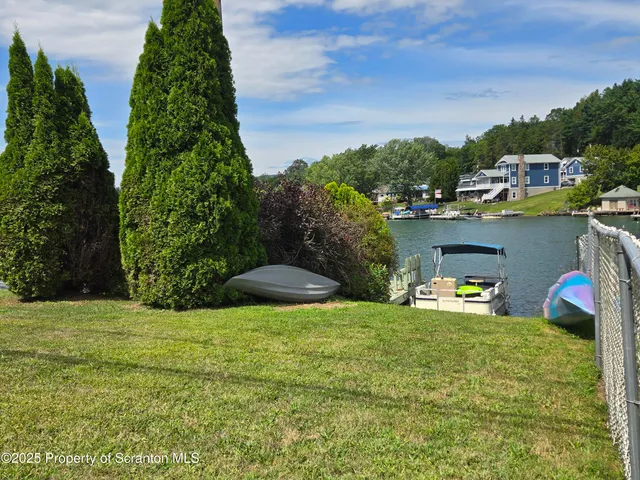 a view of swimming pool outdoor seating and yard
