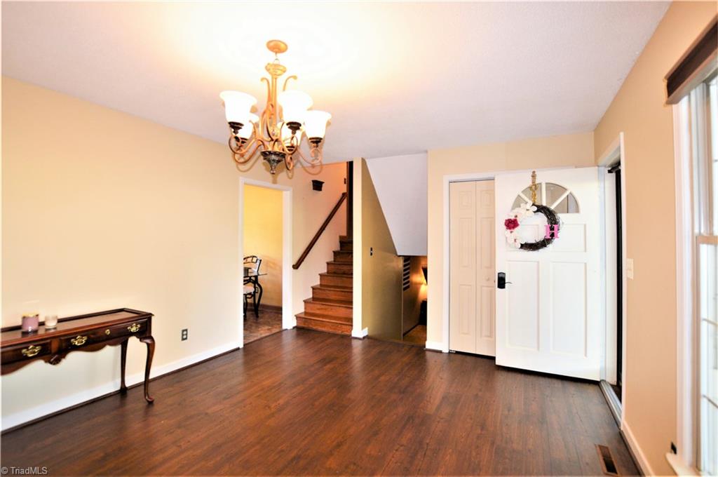 265 Pilotview Loop Madison, NC 27025 - Photo 4 of 30 Living room with stairs to upper level and stairs down to lower level