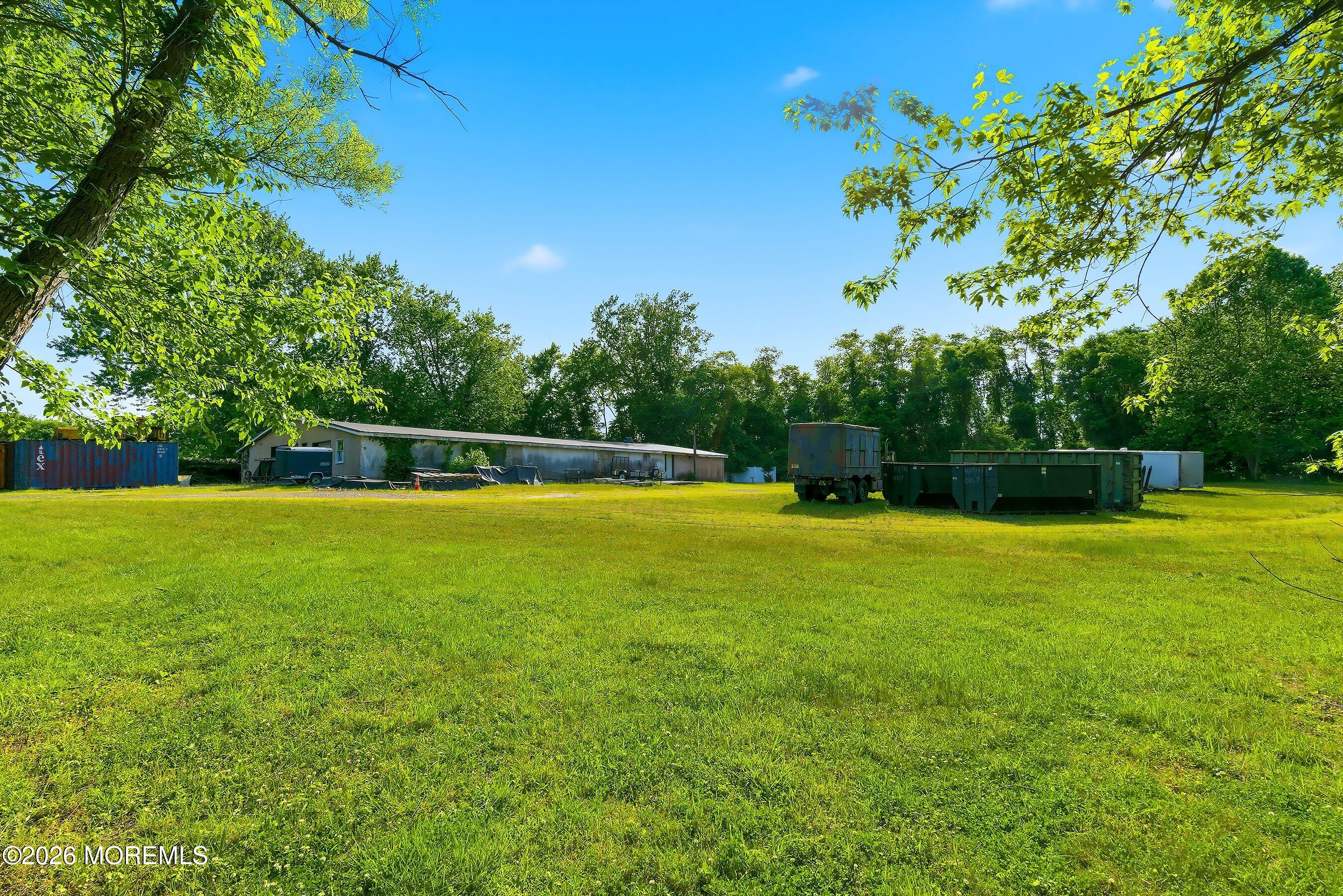 26 Megill Road Farmingdale, NJ 07727 - Photo 11 of 16 a view of a swimming pool with a yard